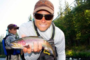 man with rainbow trout